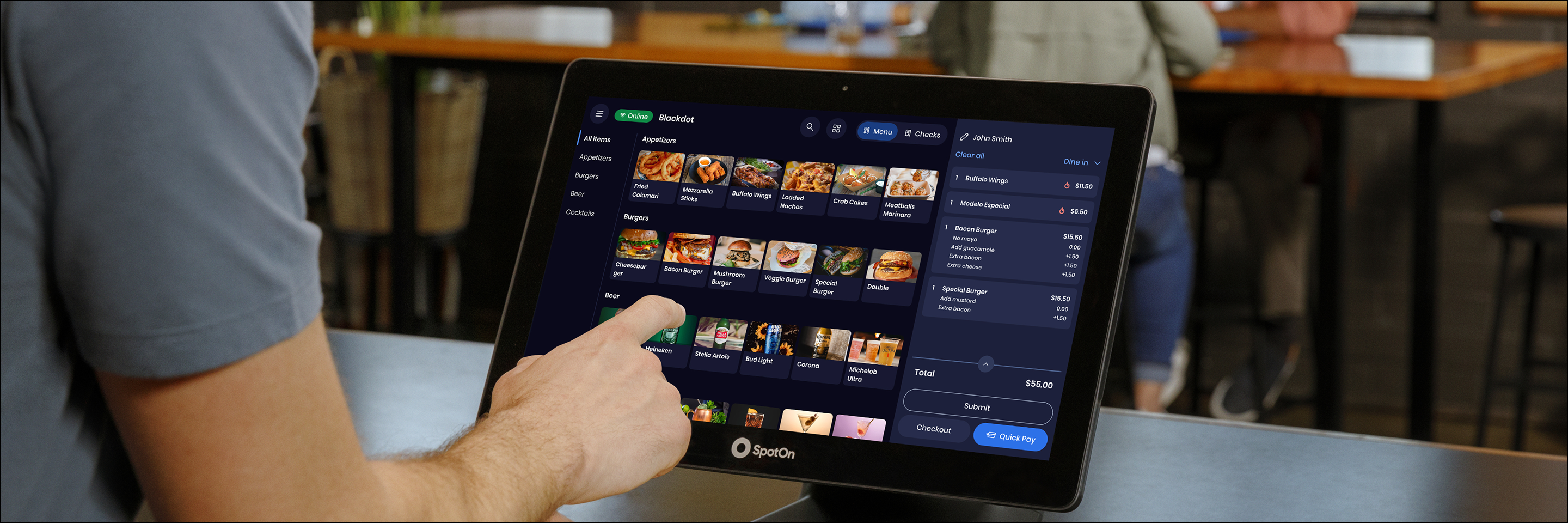 Server using SpotOn Express POS terminal in a restaurant